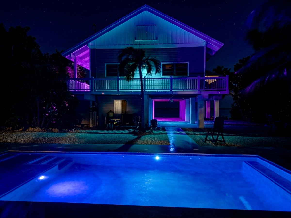 Estate at night with illuminated pool