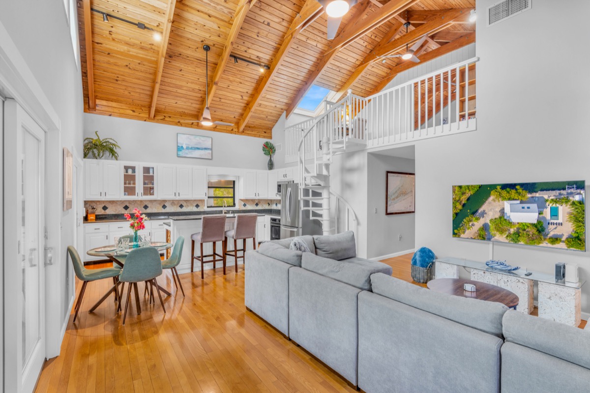 Open concept living area with vaulted ceilings